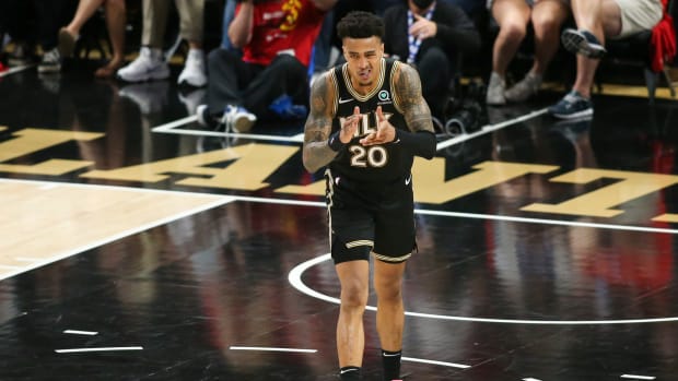 Atlanta Hawks forward John Collins (20) celebrates after a dunk against the Philadelphia 76ers in the third quarter during game four in the second round of the 2021 NBA Playoffs at State Farm Arena.